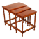 Nested tables in satin wood with brass inlays.