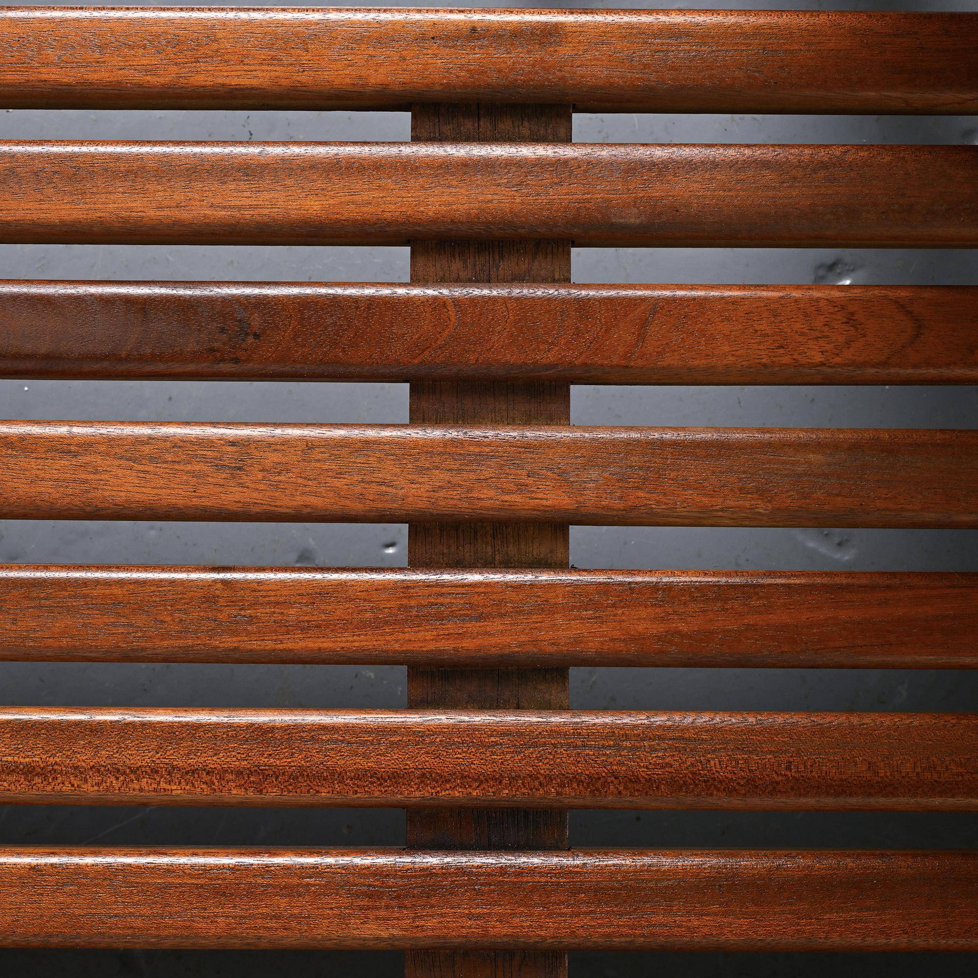 Cansado bench in mahogany by Charlotte Perriand, circa 1962.