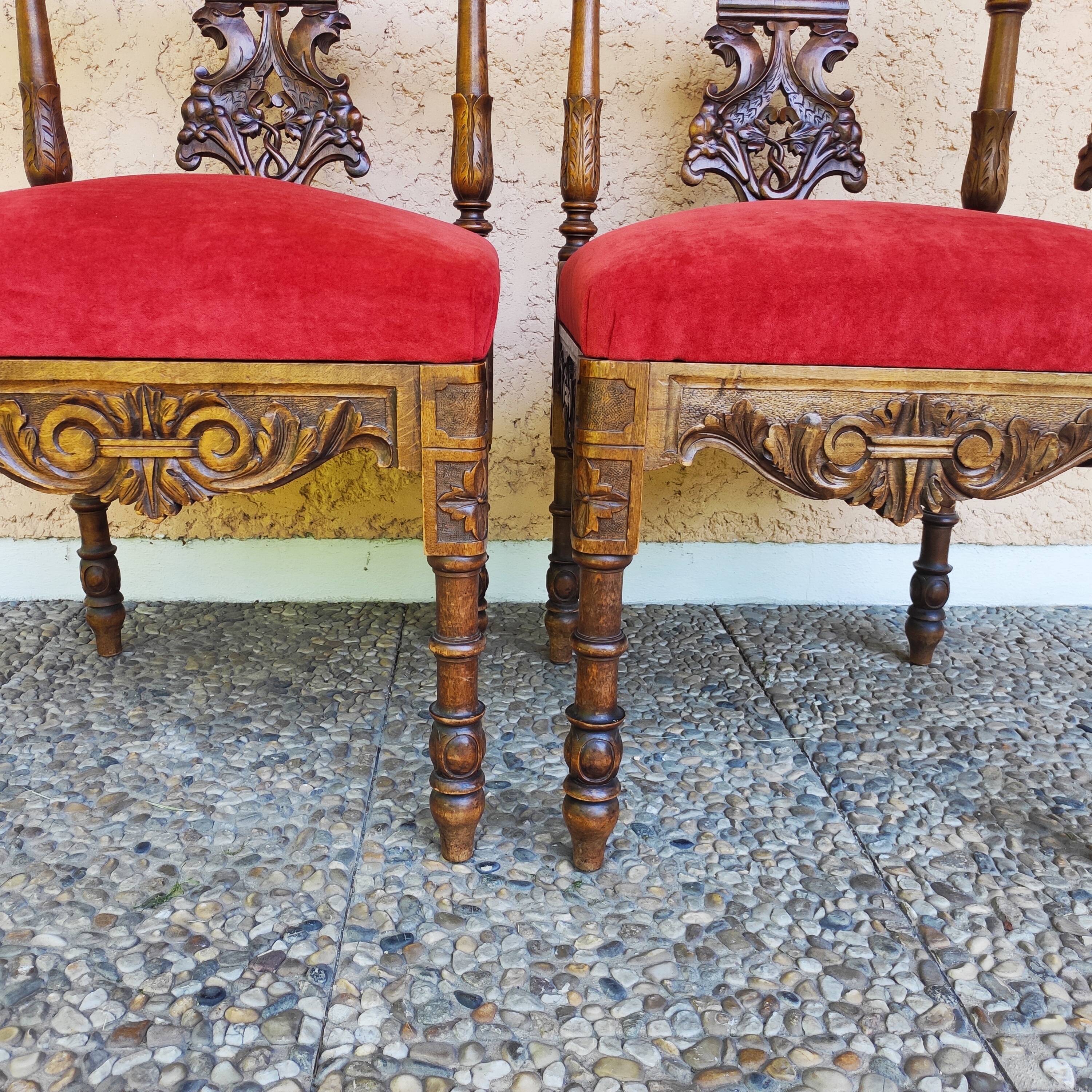 Pair of neo-Renaissance Henri II corner armchairs in carved wood, 19th century.