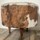 Tripod storage pouffe in wood and cowhide from the 60s-70s.