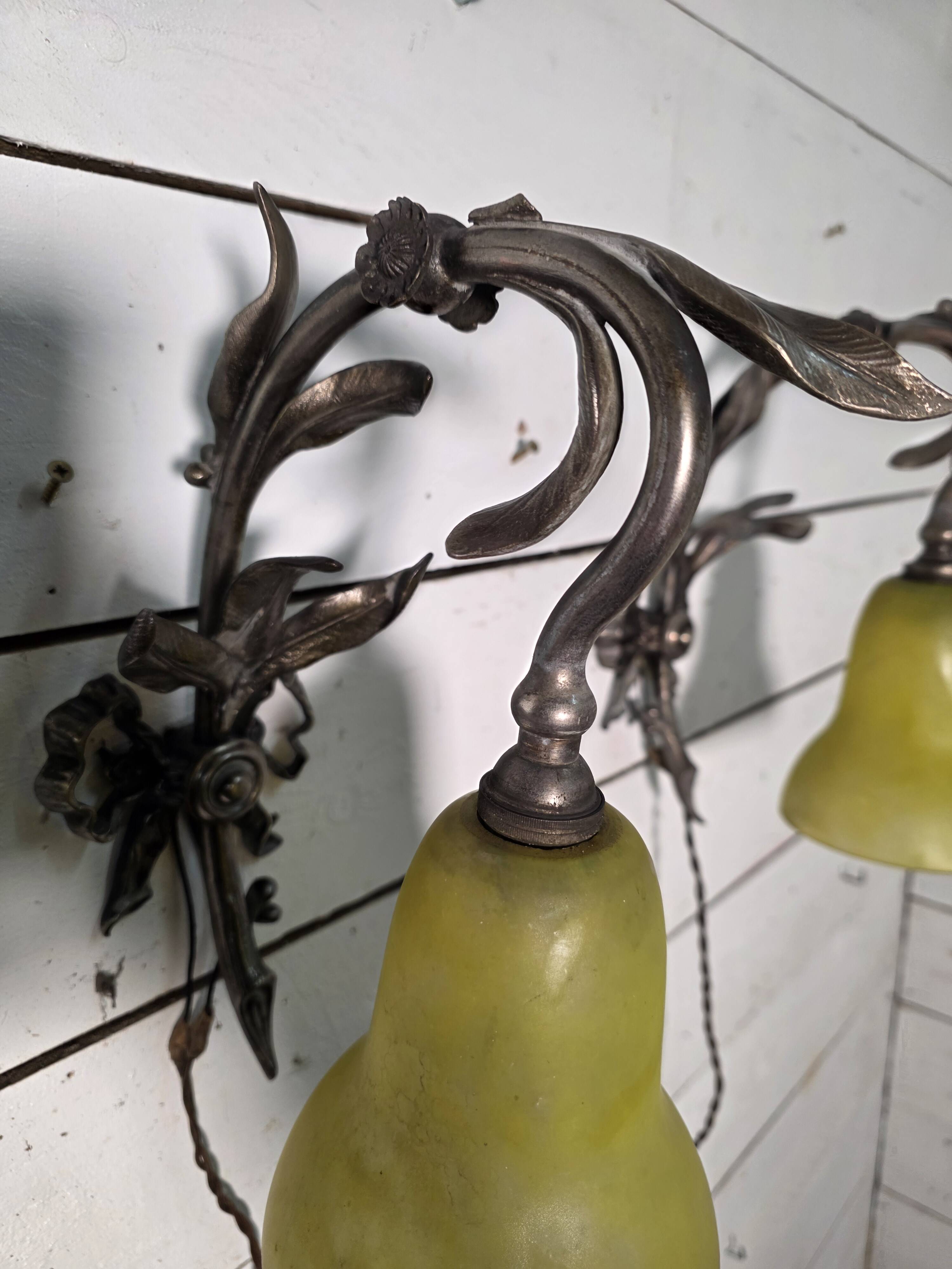 Pair of Louis XVI style bronze wall sconces