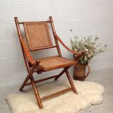 Bamboo folding armchair and caning, leather and brass