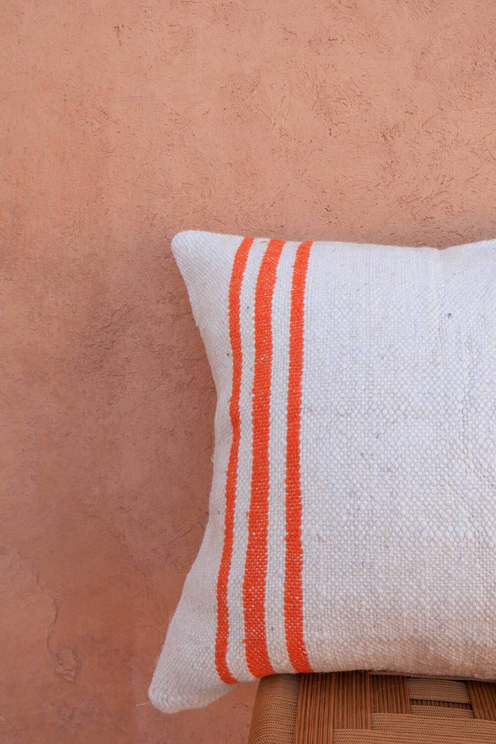 Orange and white striped handmade wool cushion