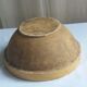 Large old salad bowl in yellow varnished earth