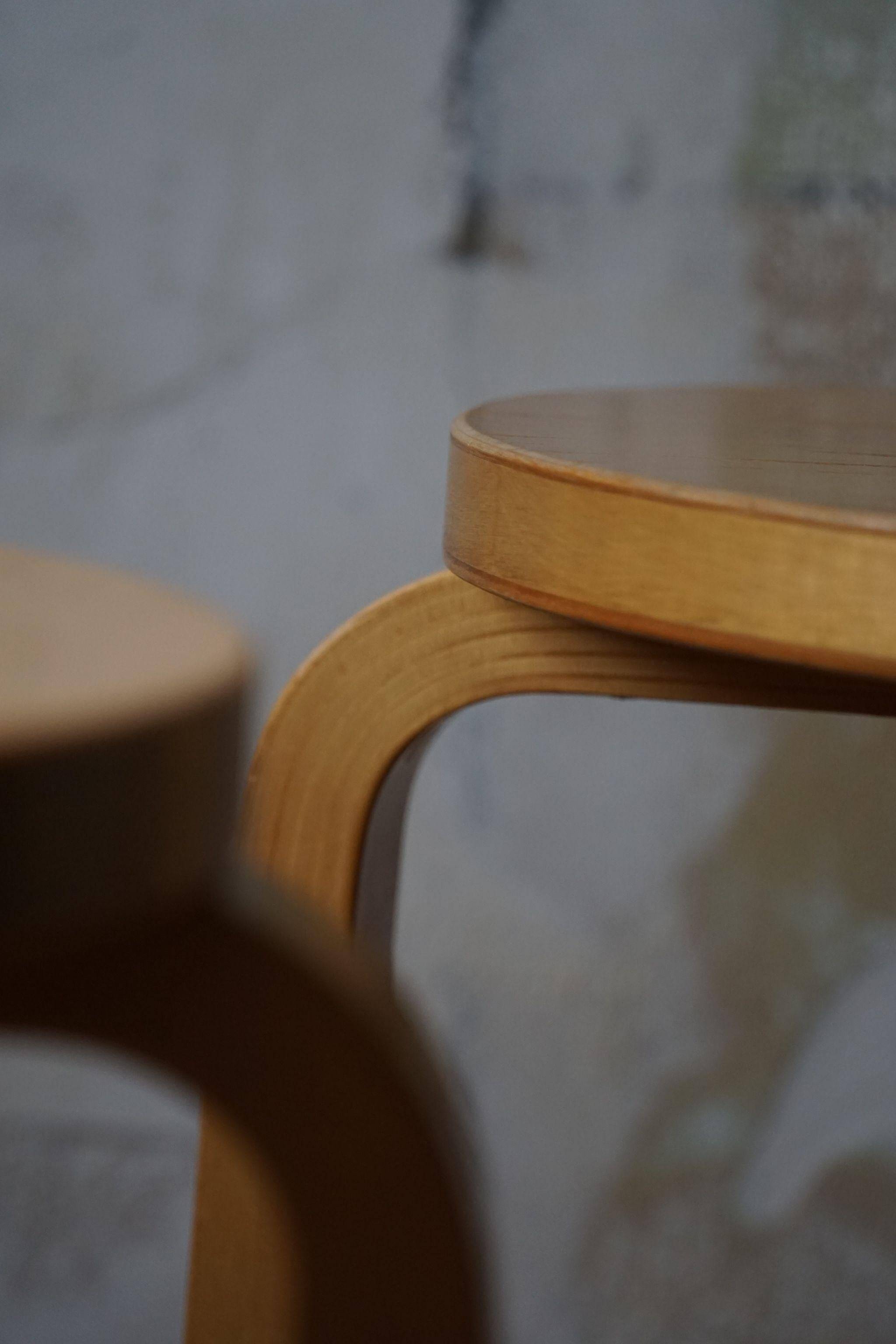 Alvar Aalto, a pair of vintage birch stools, model "60", made by Artek, 1970s.