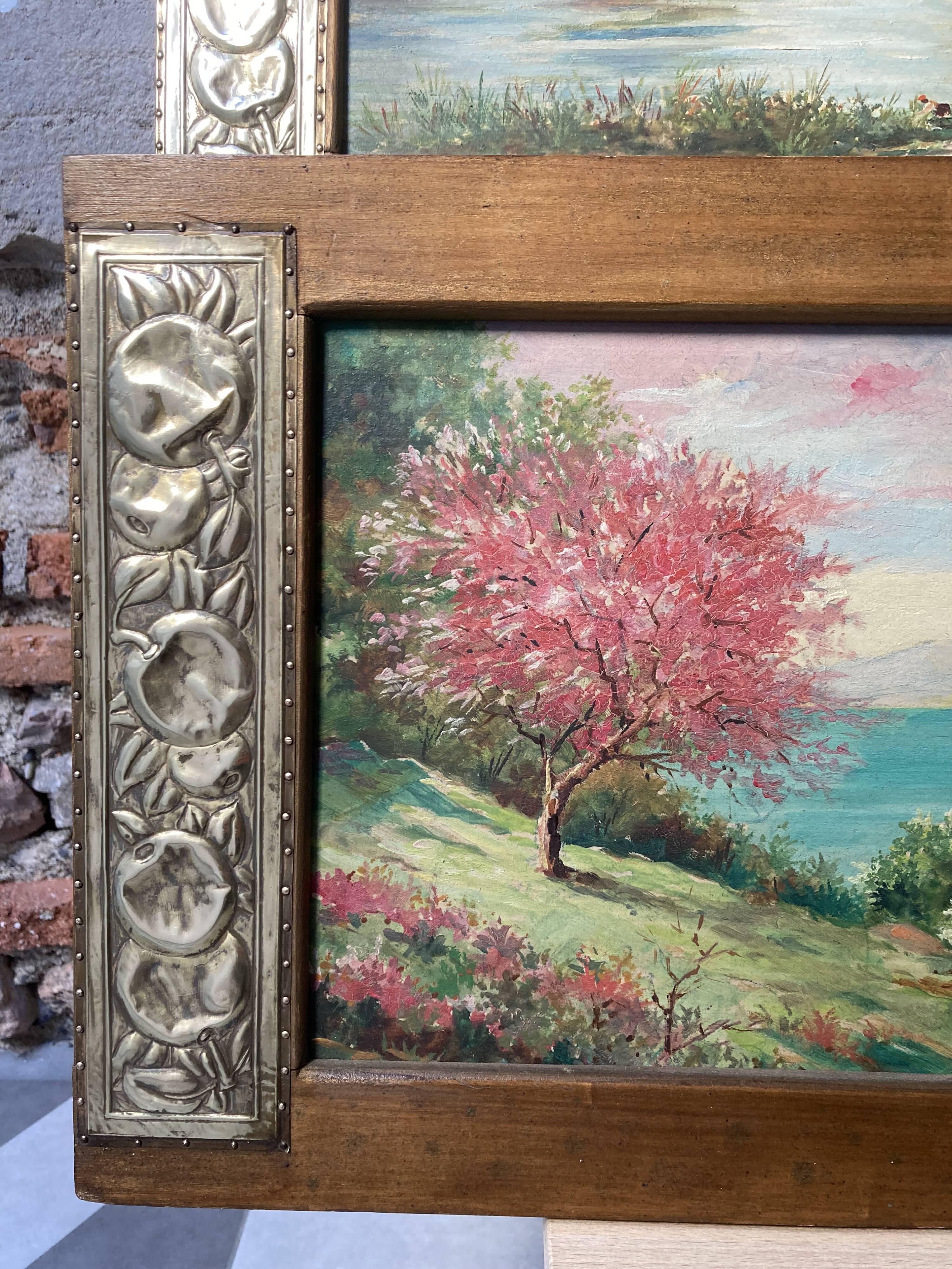 Pair of Art Deco wood and embossed metal landscape frames