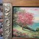 Pair of Art Deco wood and embossed metal landscape frames