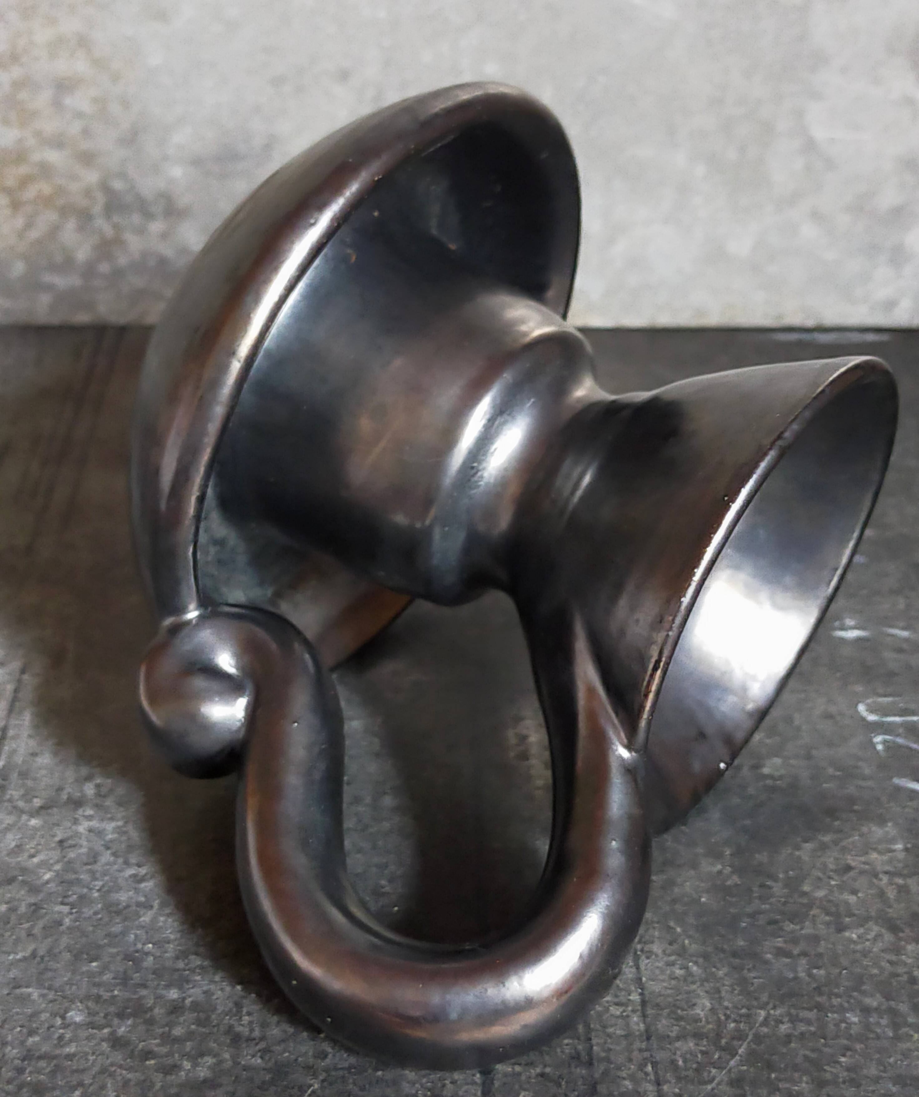 1950s iridescent black ceramic hand candle holder