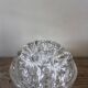 Large round glass flower frog vase with 19 holes.