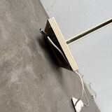 Floor lamp with articulated arm in brass-plated metal