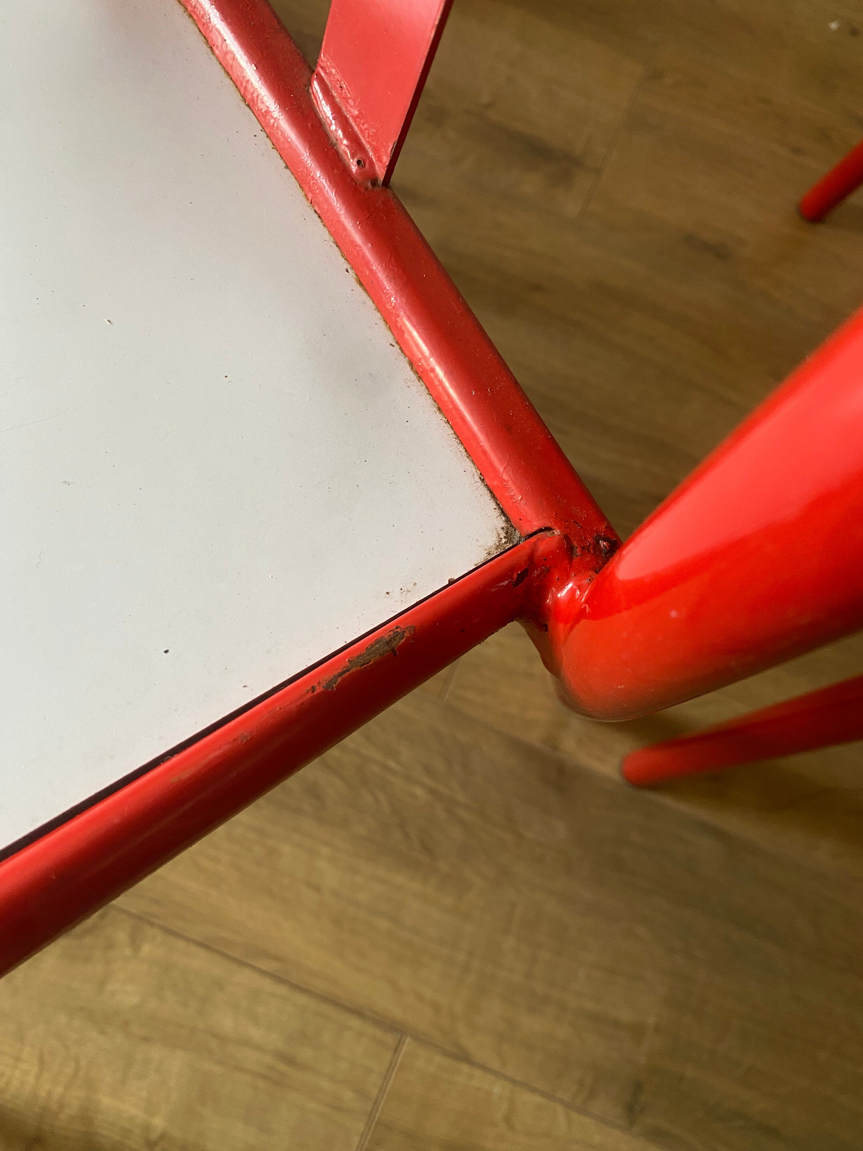 4 red metal chairs by Mallet-Stevens