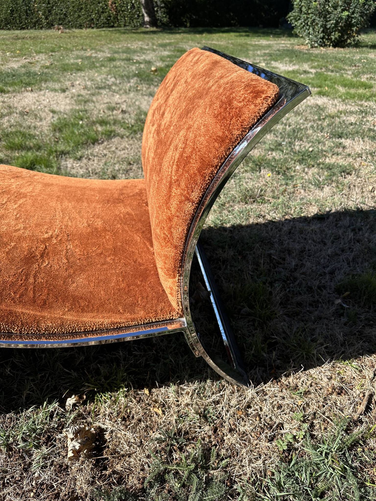 Chrome steel armchair and orange fabric by Vittorio Introini