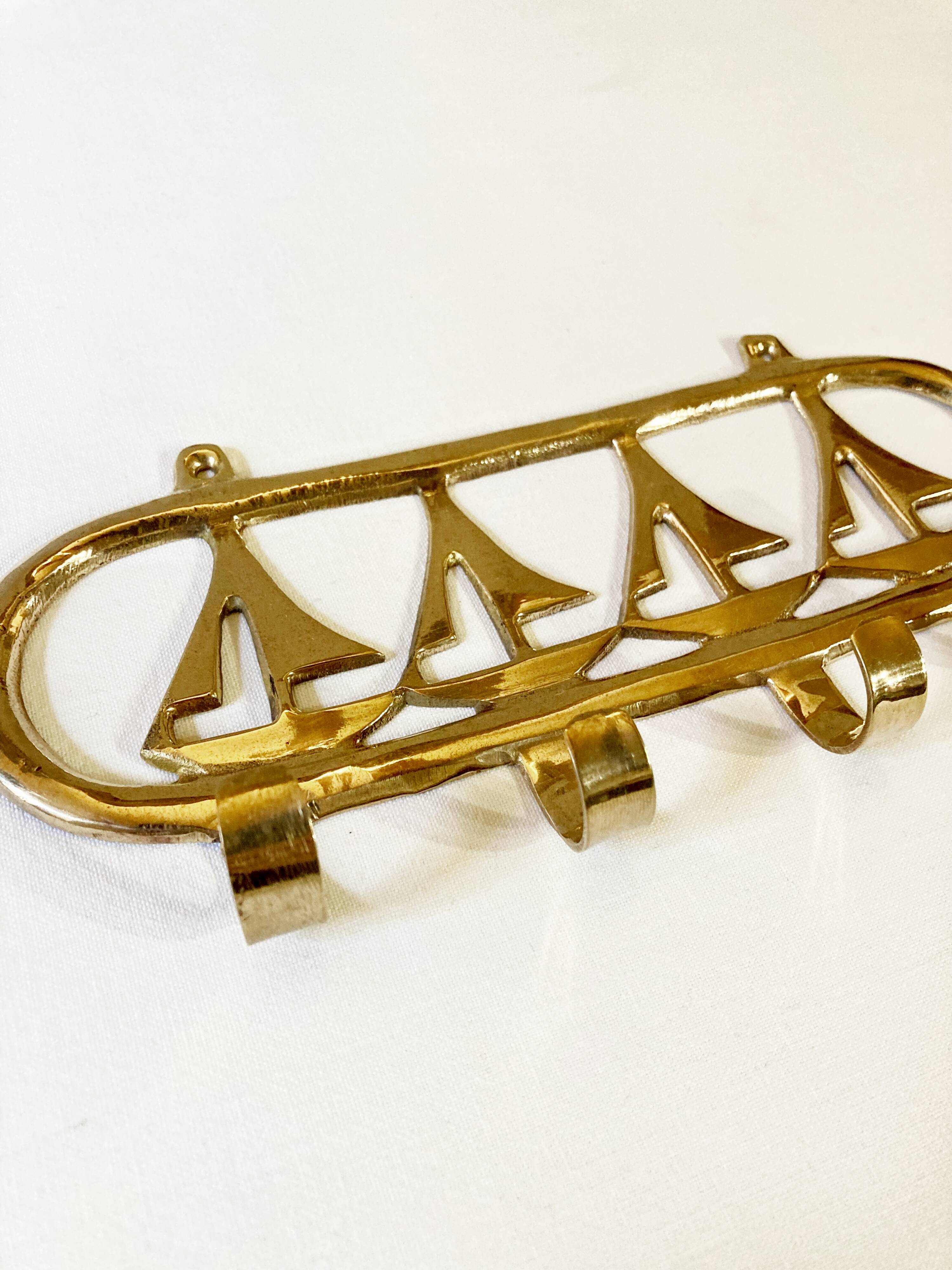 Coat hook in gilded brass, sailboat motifs