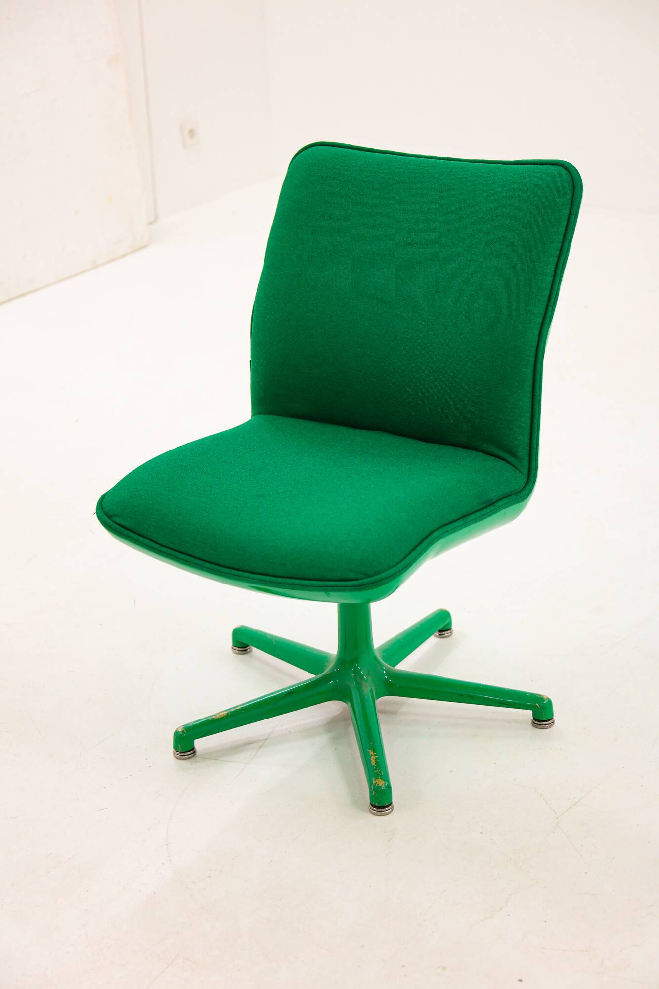 Green Artifort armchair, design by Geoffrey Harcourt.