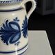 Artisan blue floral decorative carafe, height 17 cm, diameter 24.5 cm.