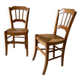 Set of 2 antique wooden and straw chairs.