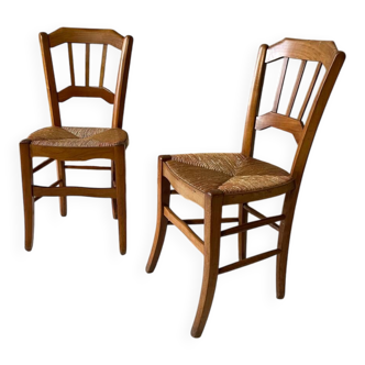 Set of 2 antique wooden and straw chairs.