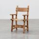 Brutalist armchair with carved rosettes and nailed wooden seat, Spain