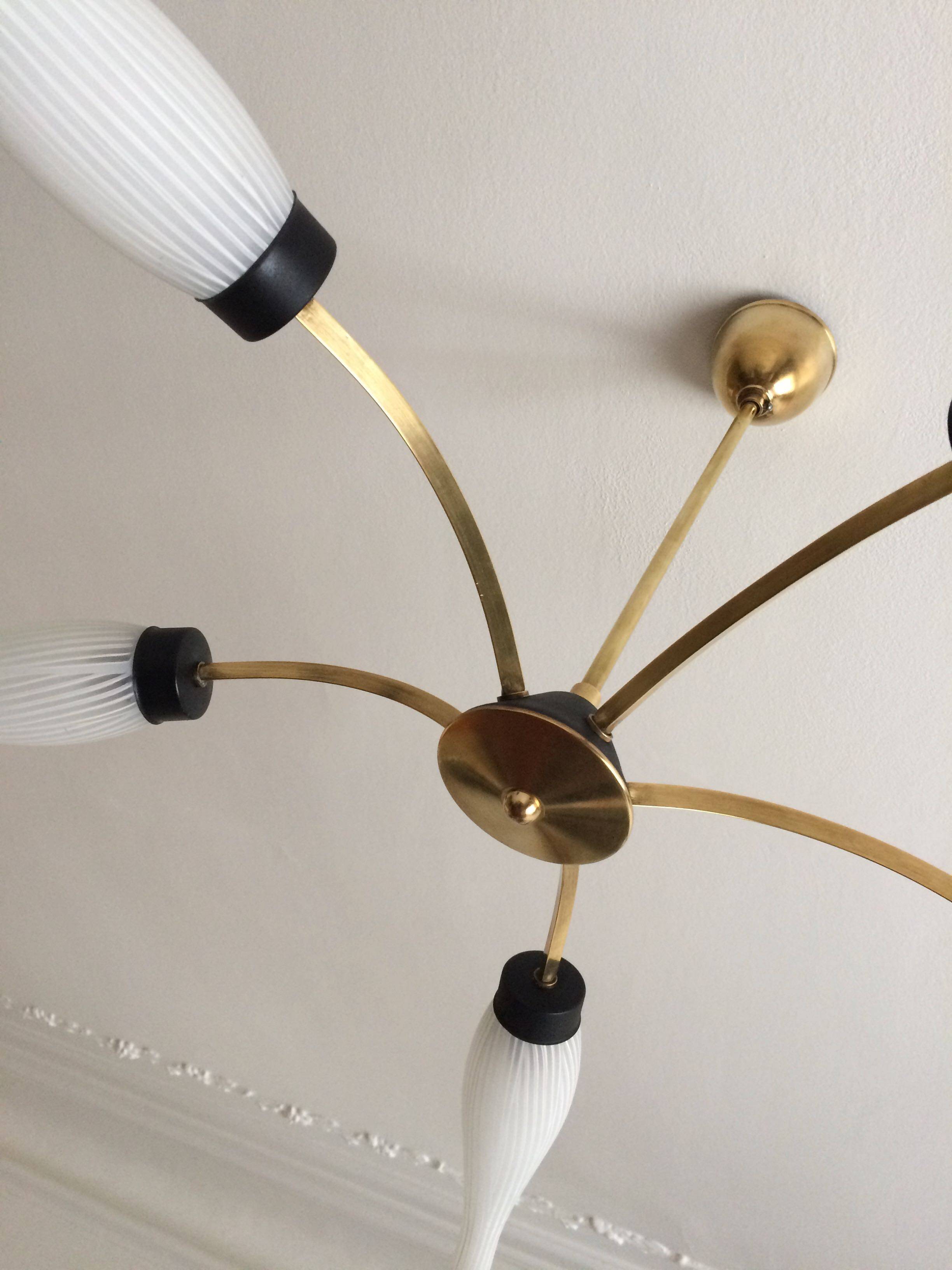 Lustre with 5 branches from the 1960s - 1970s in solid brass and black metal.