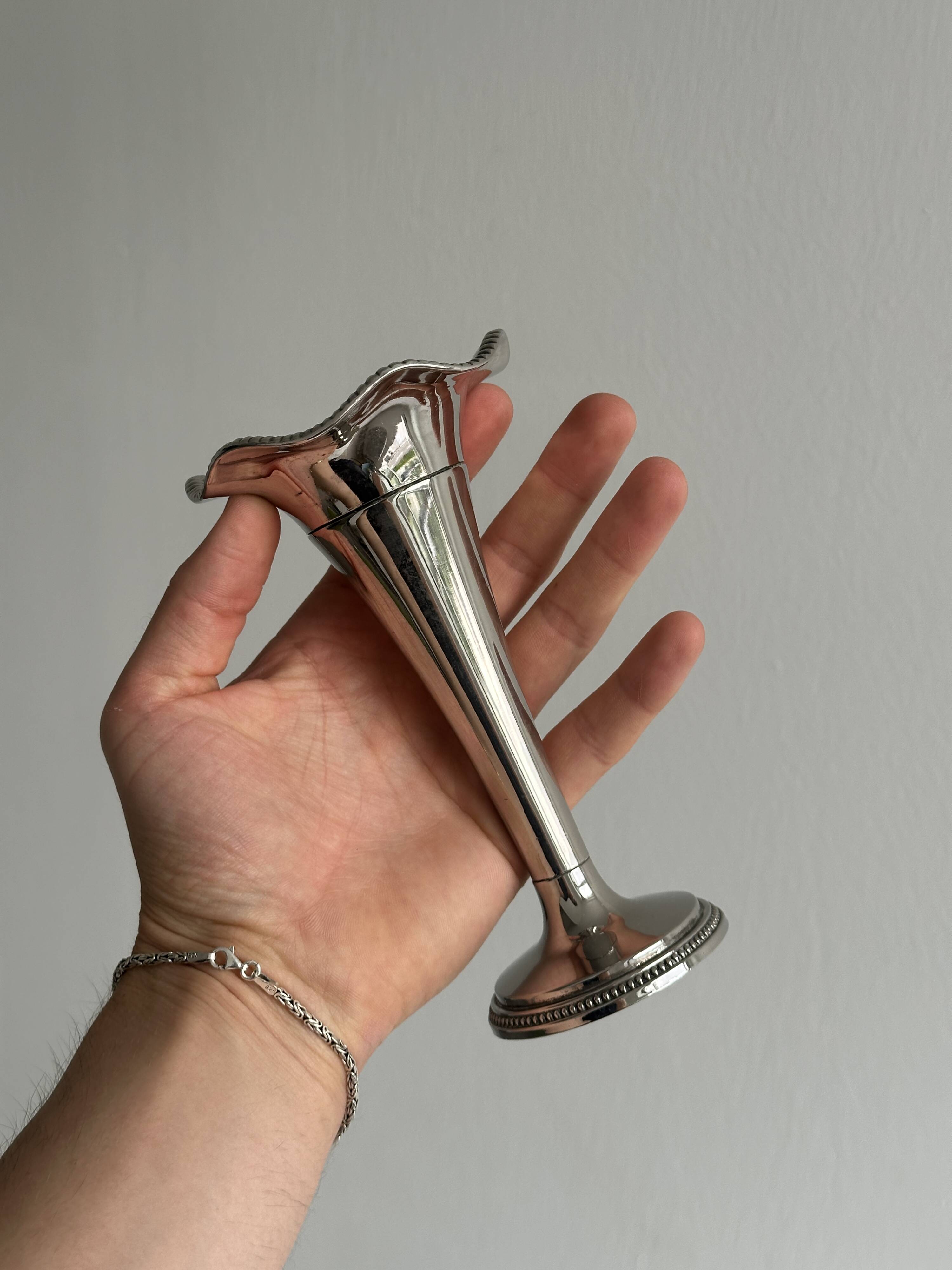 Small silver metal vase