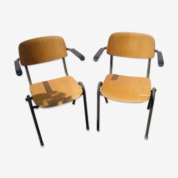 Pair of stackable class armchairs with Bakelite armrests