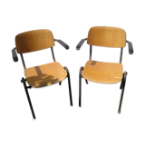 Pair of stackable class armchairs with Bakelite armrests