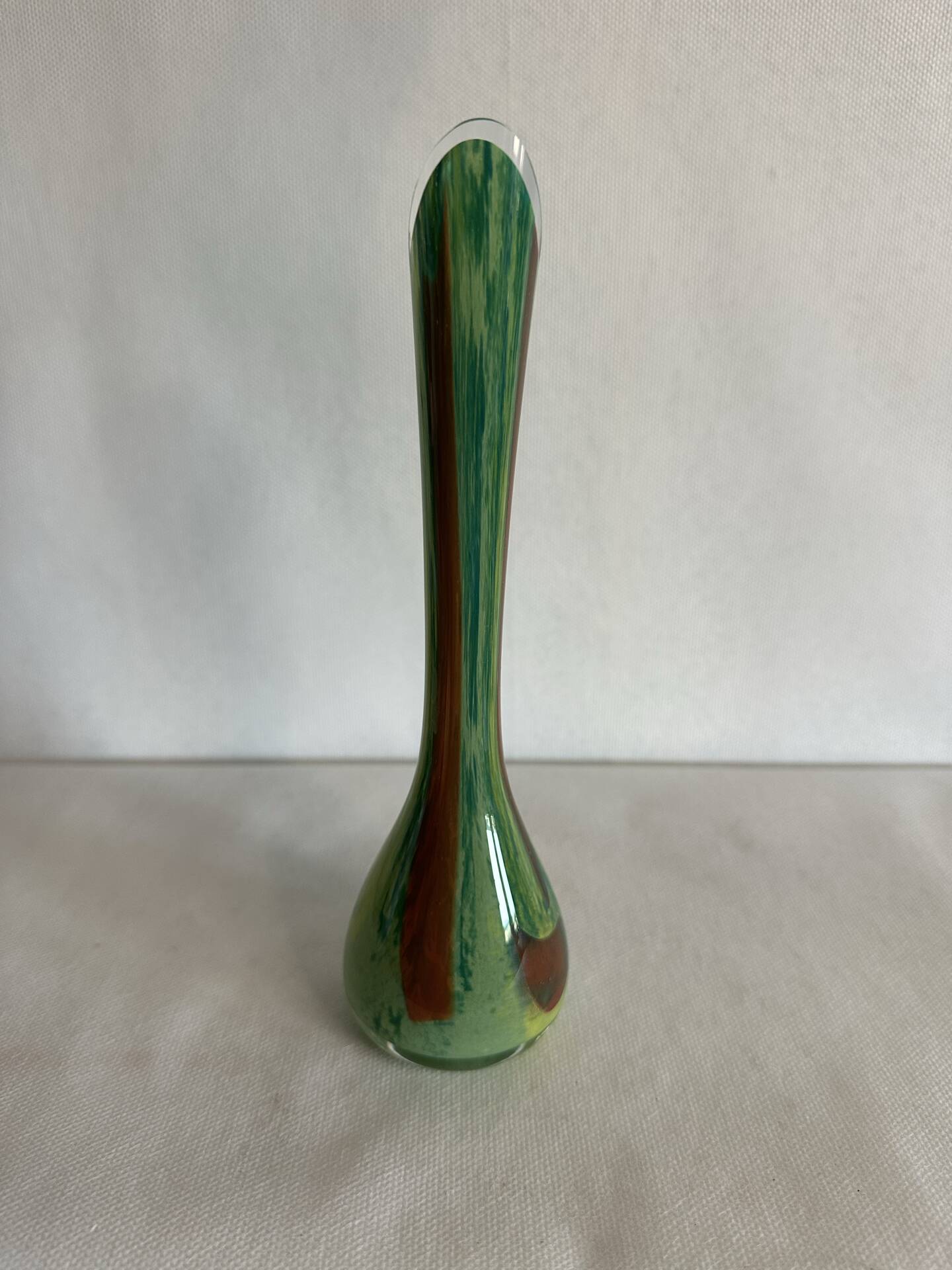 Single flower vase in blown green glass