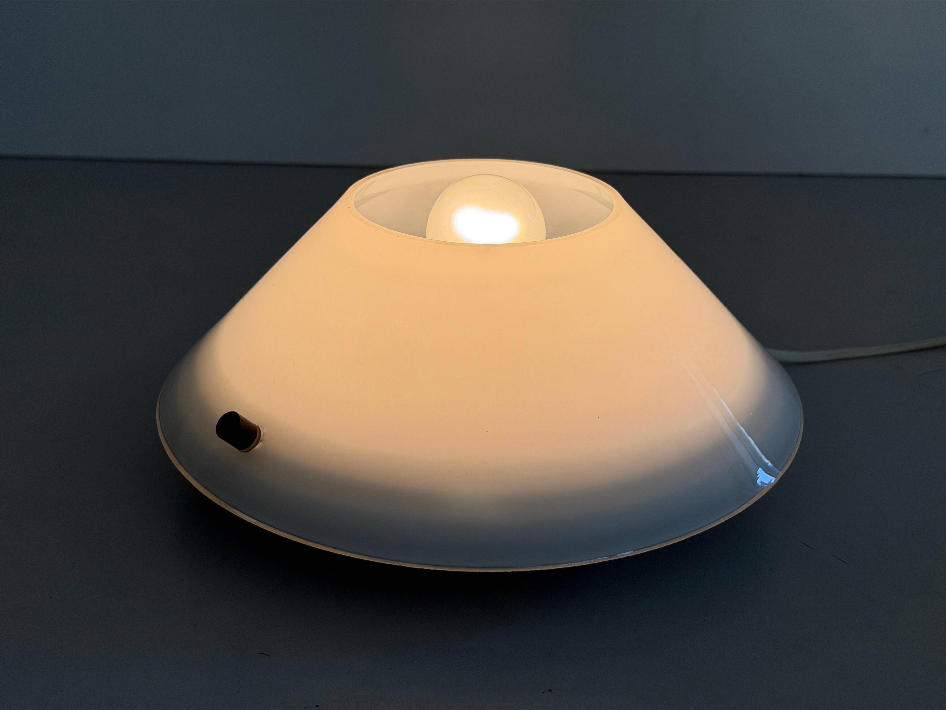 Pair of opal glass wall lights from the mid-century by Lamperti, 1960s, Italy.