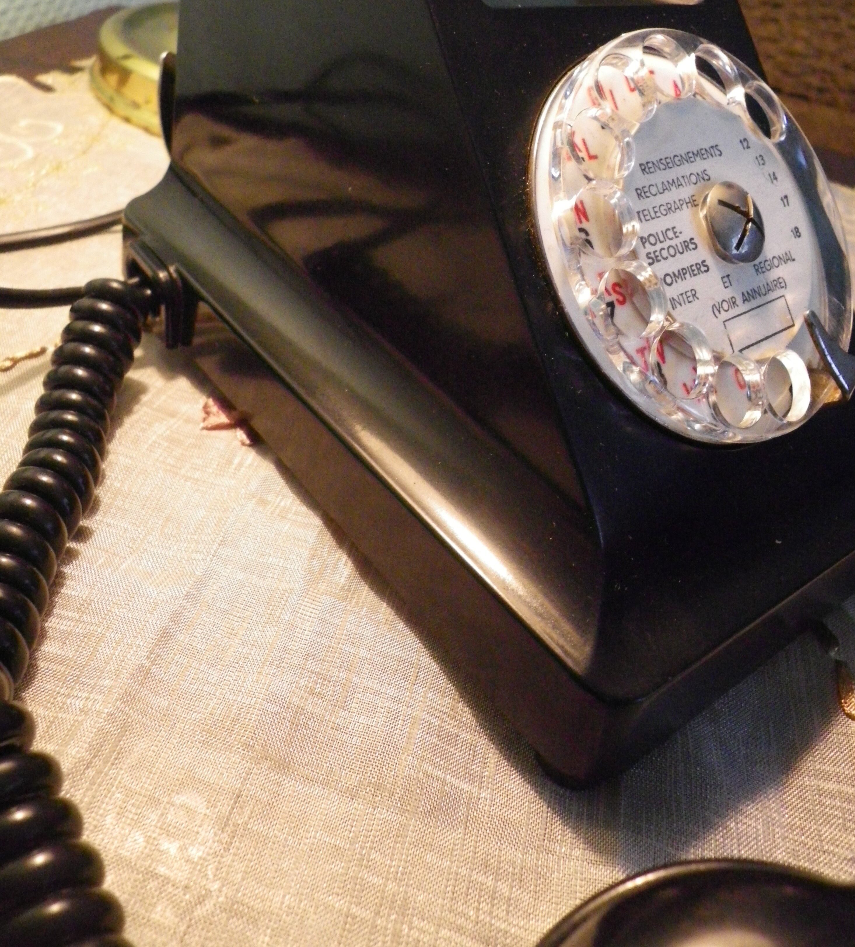 Black bakelite phone with earphone