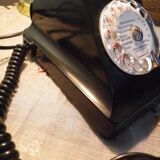 Black bakelite phone with earphone