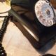 Black bakelite phone with earphone