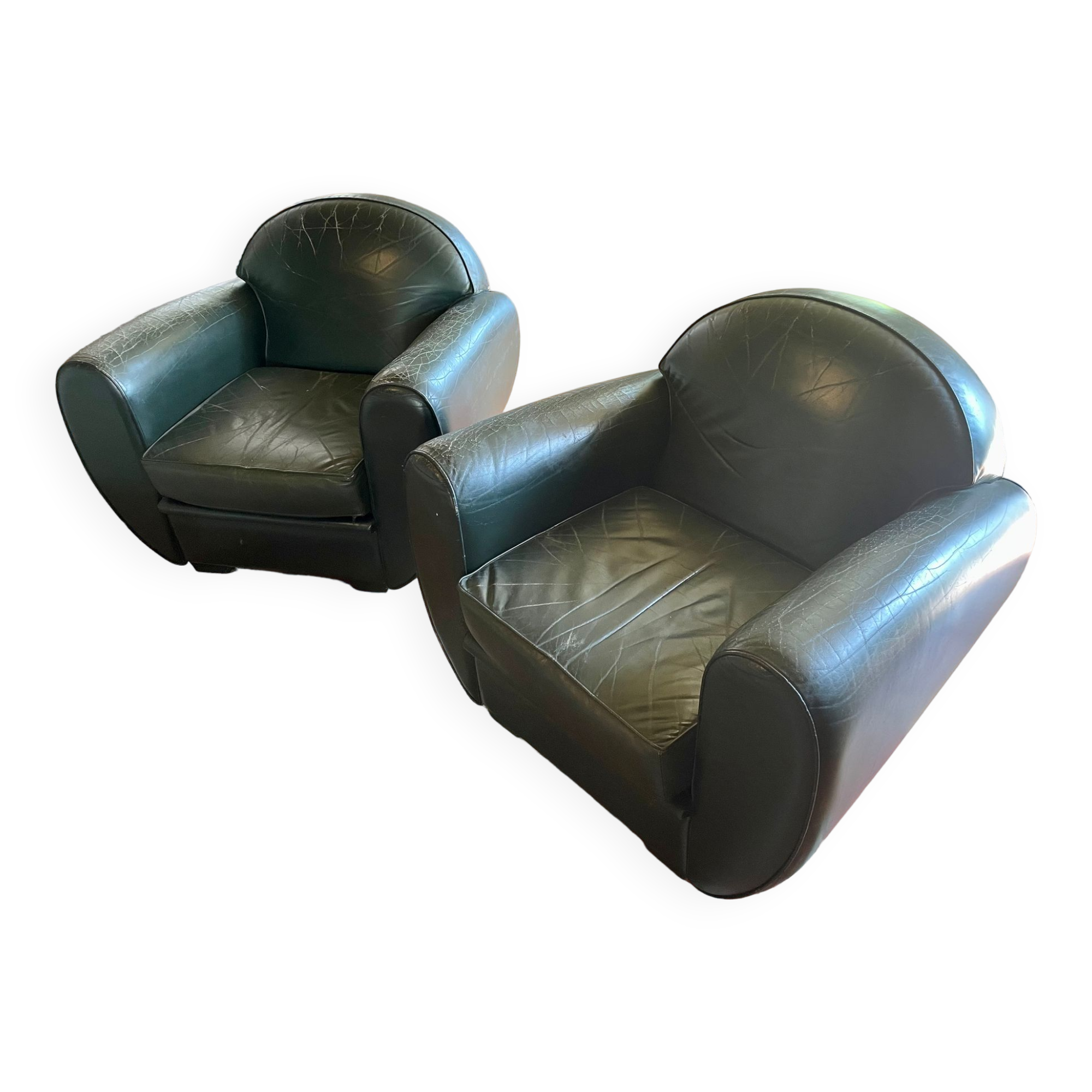 Green leather club chairs