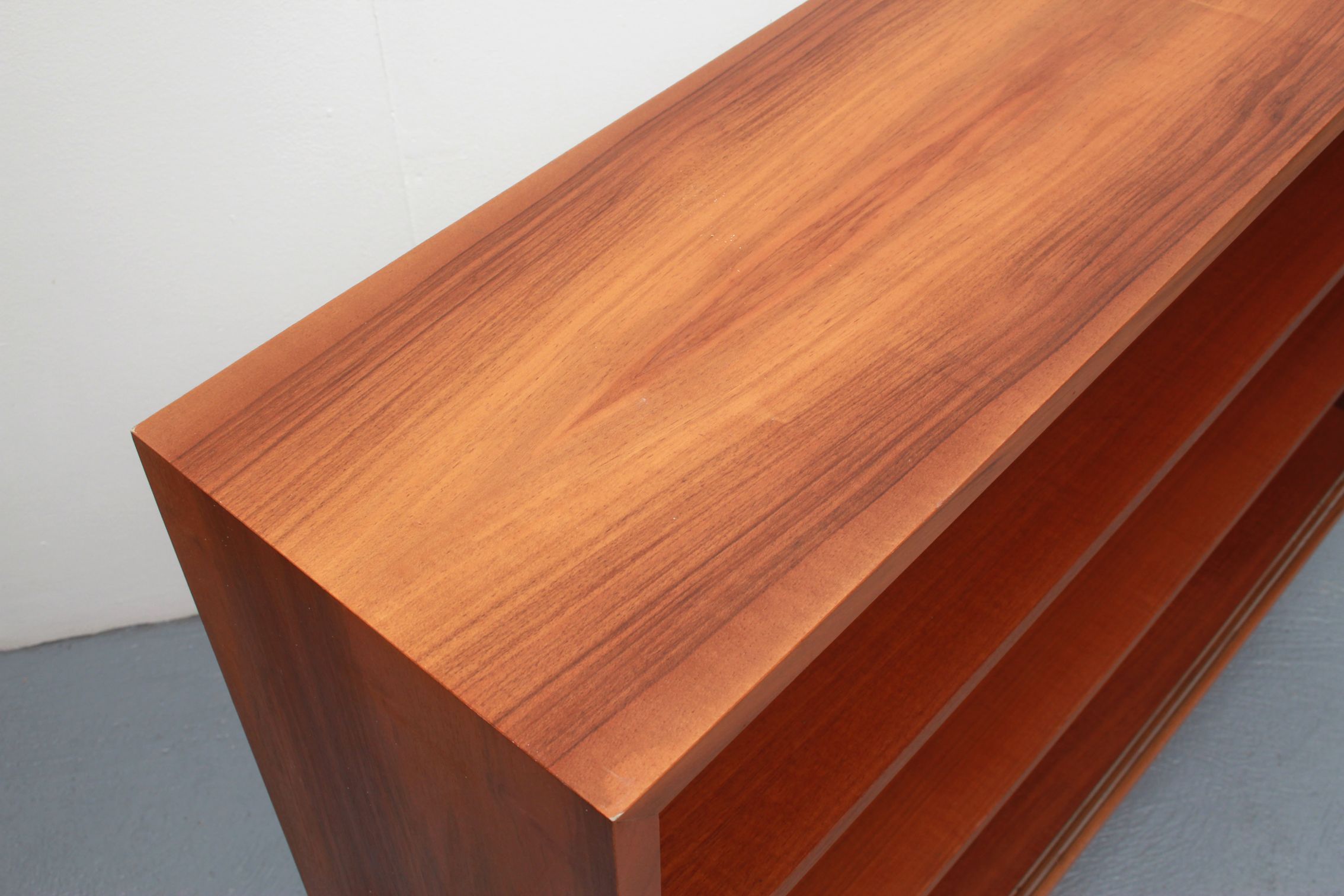 1960s book shelf in walnut, white back panel