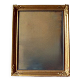 Old large wall frame in gilded carved wood