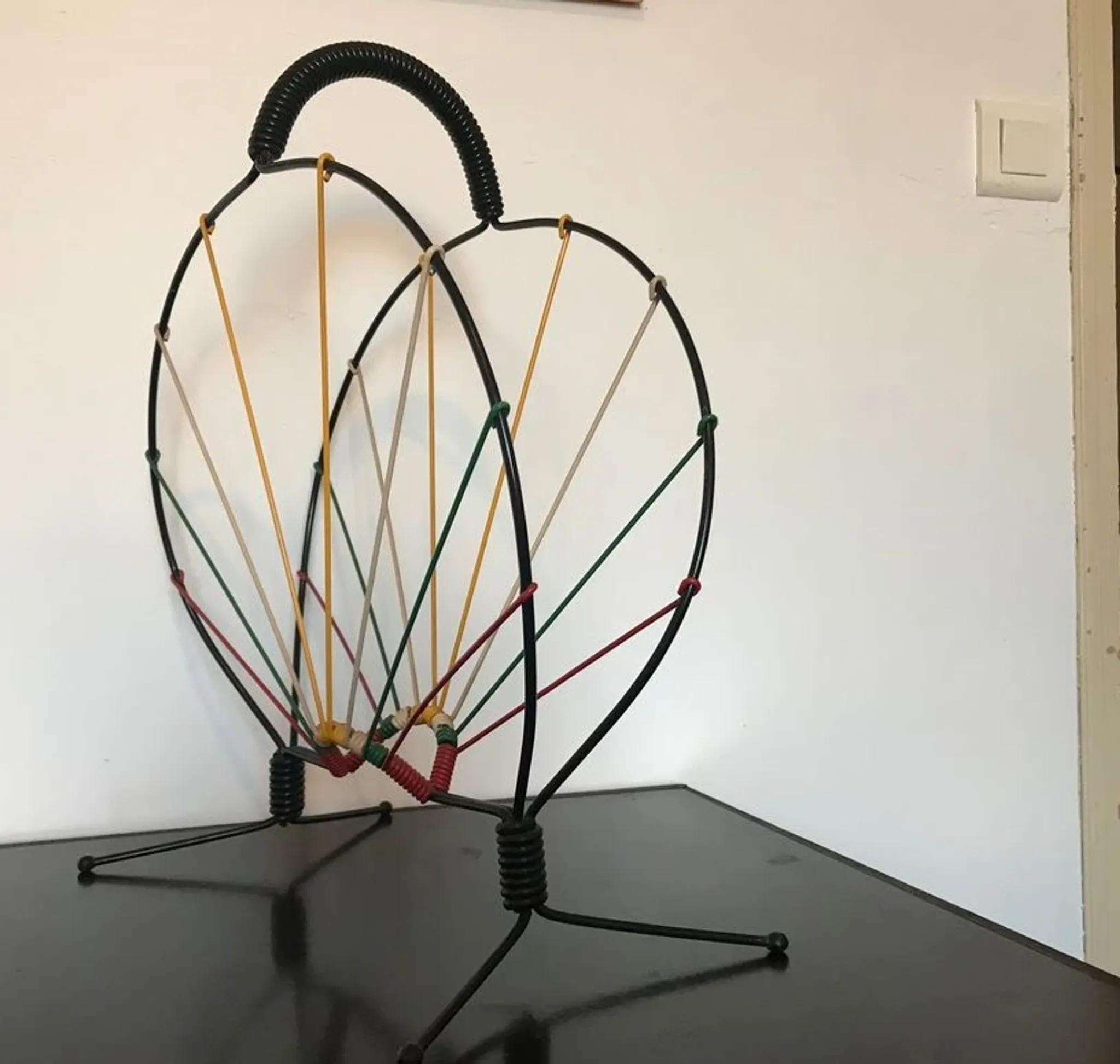 Vintage wire magazine rack from the 1950s.