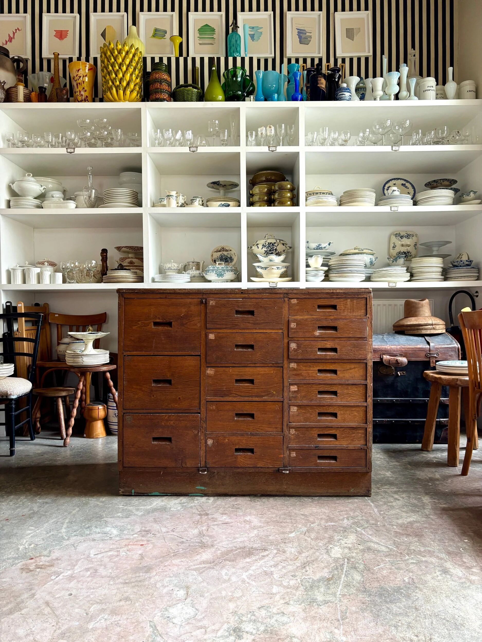 Craftsman's cabinet with 16 drawers in dark wood.