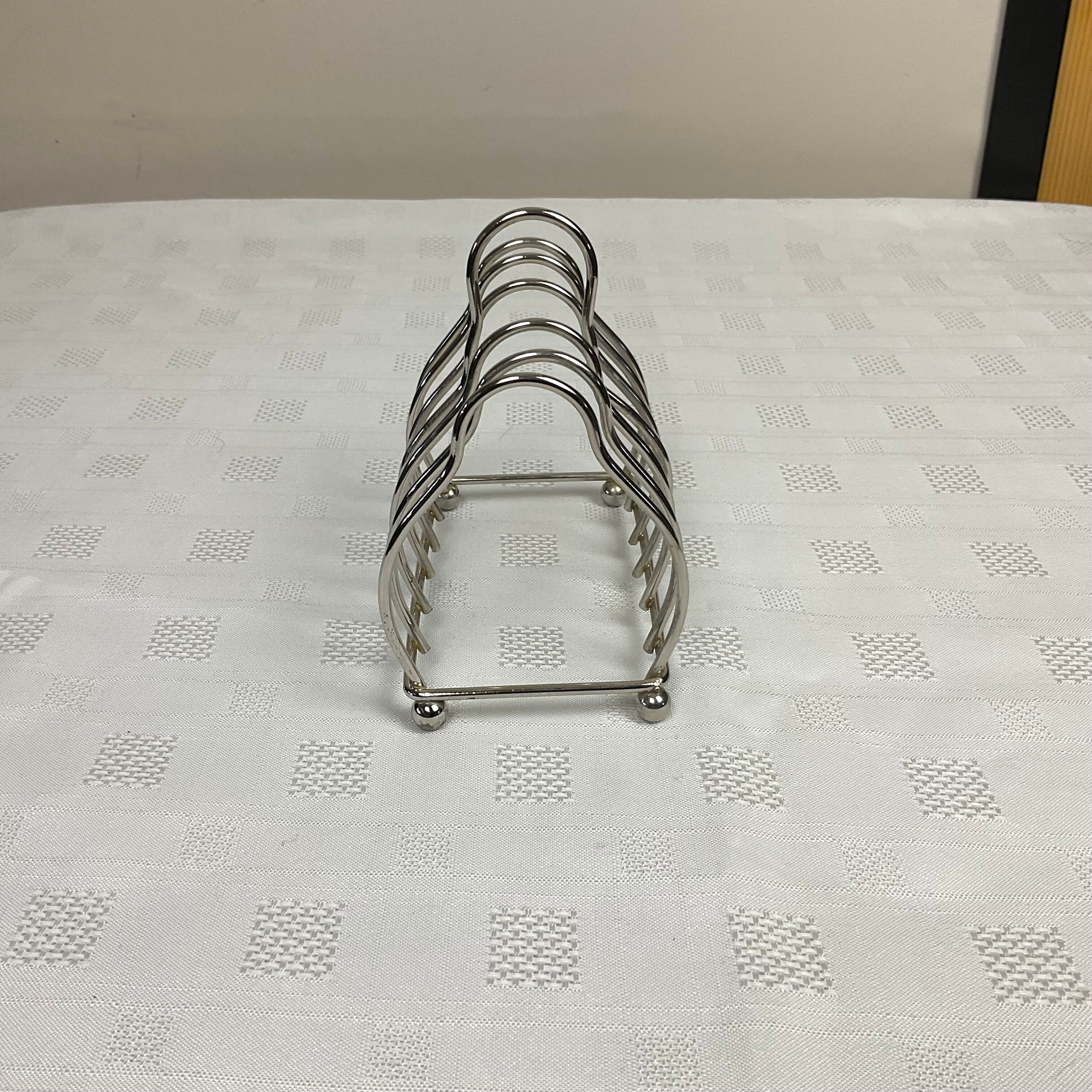 Toast holder in silver metal