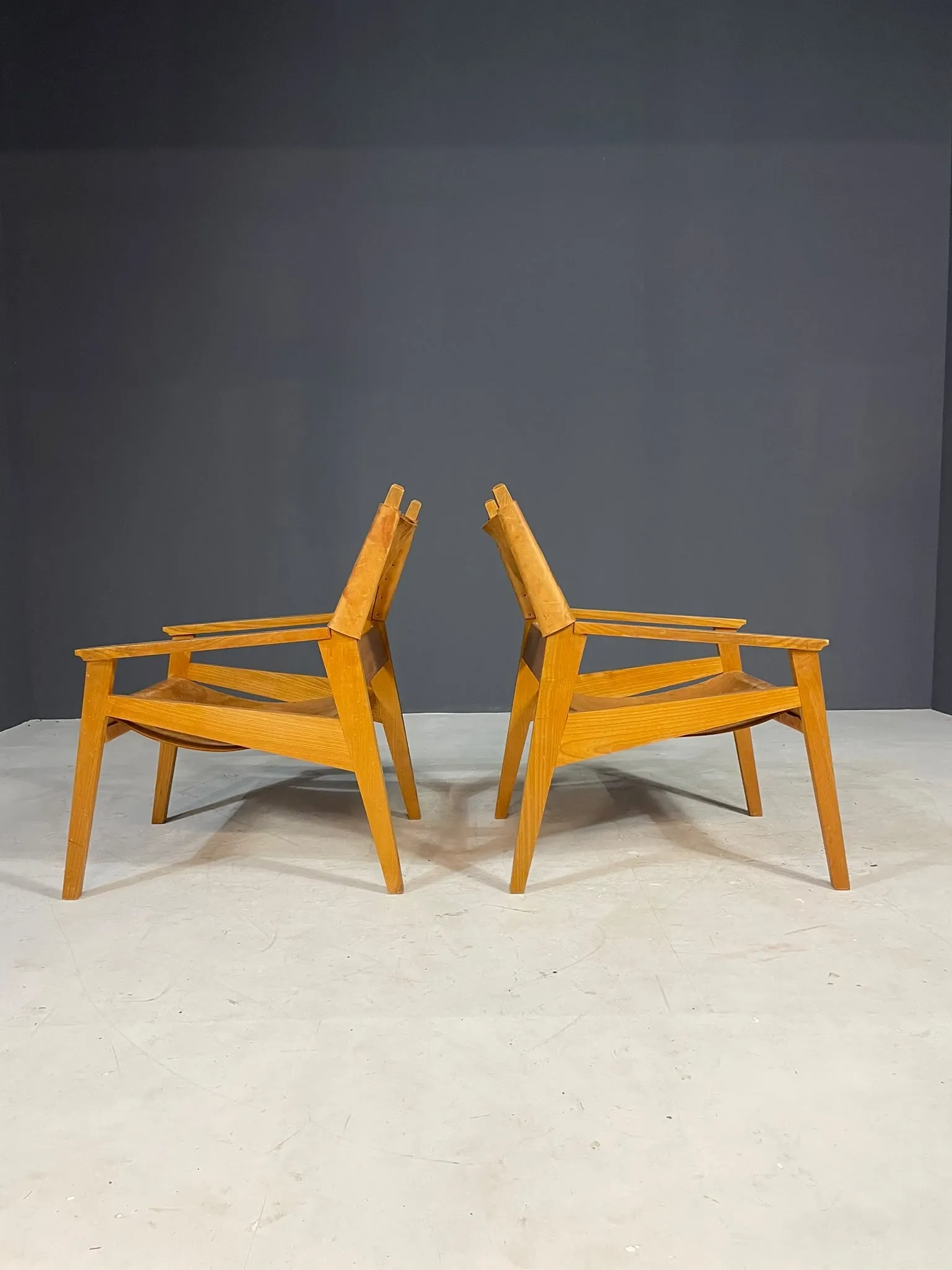 Pair of vintage wooden armchairs with leather upholstery, 20th century, 75 × 56 × 65 cm