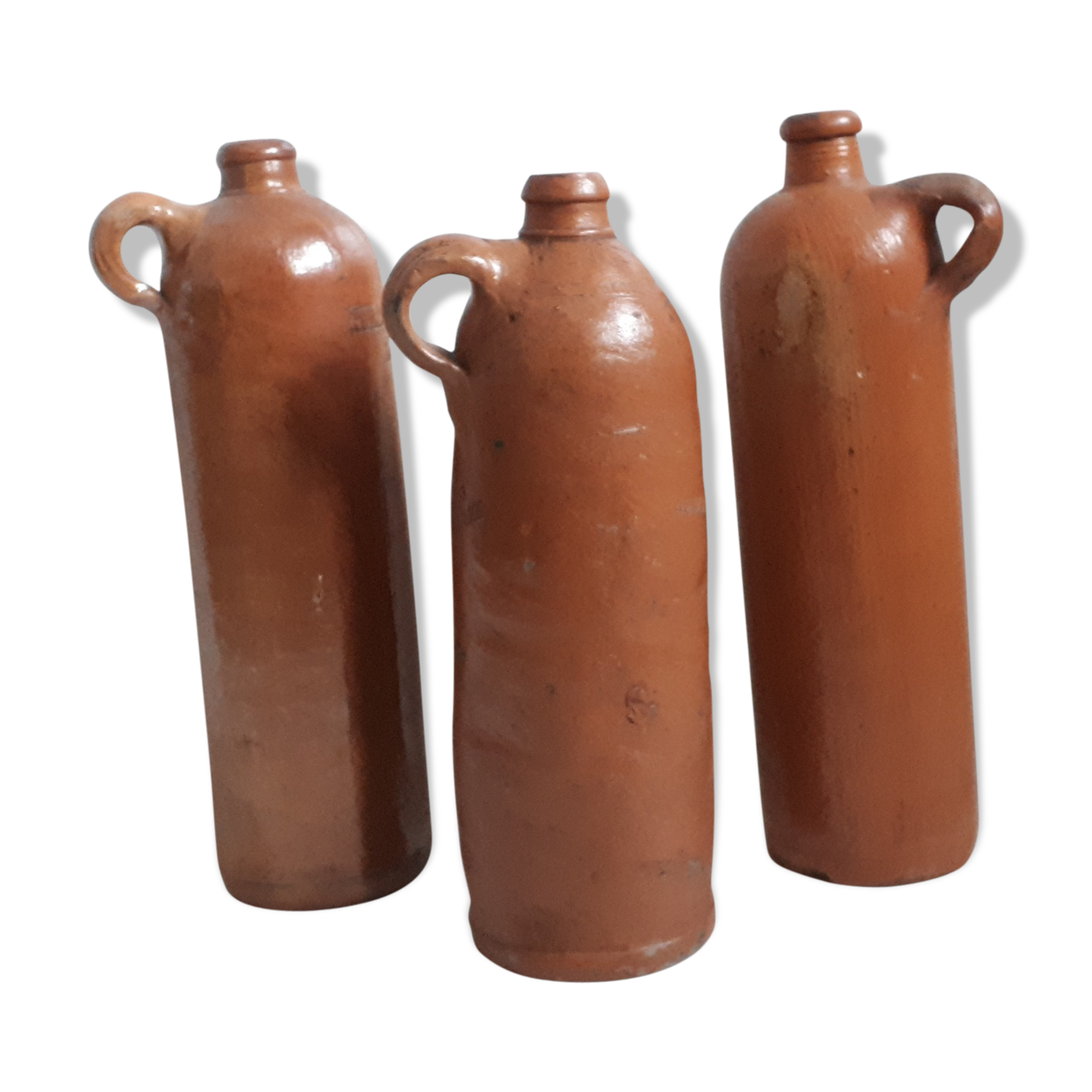 Trio of sandstone bottles