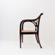 Mid-century curved wooden chairs with cane seats and backs.