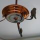 Petit lustre en cuivre "oiseaux" art déco.