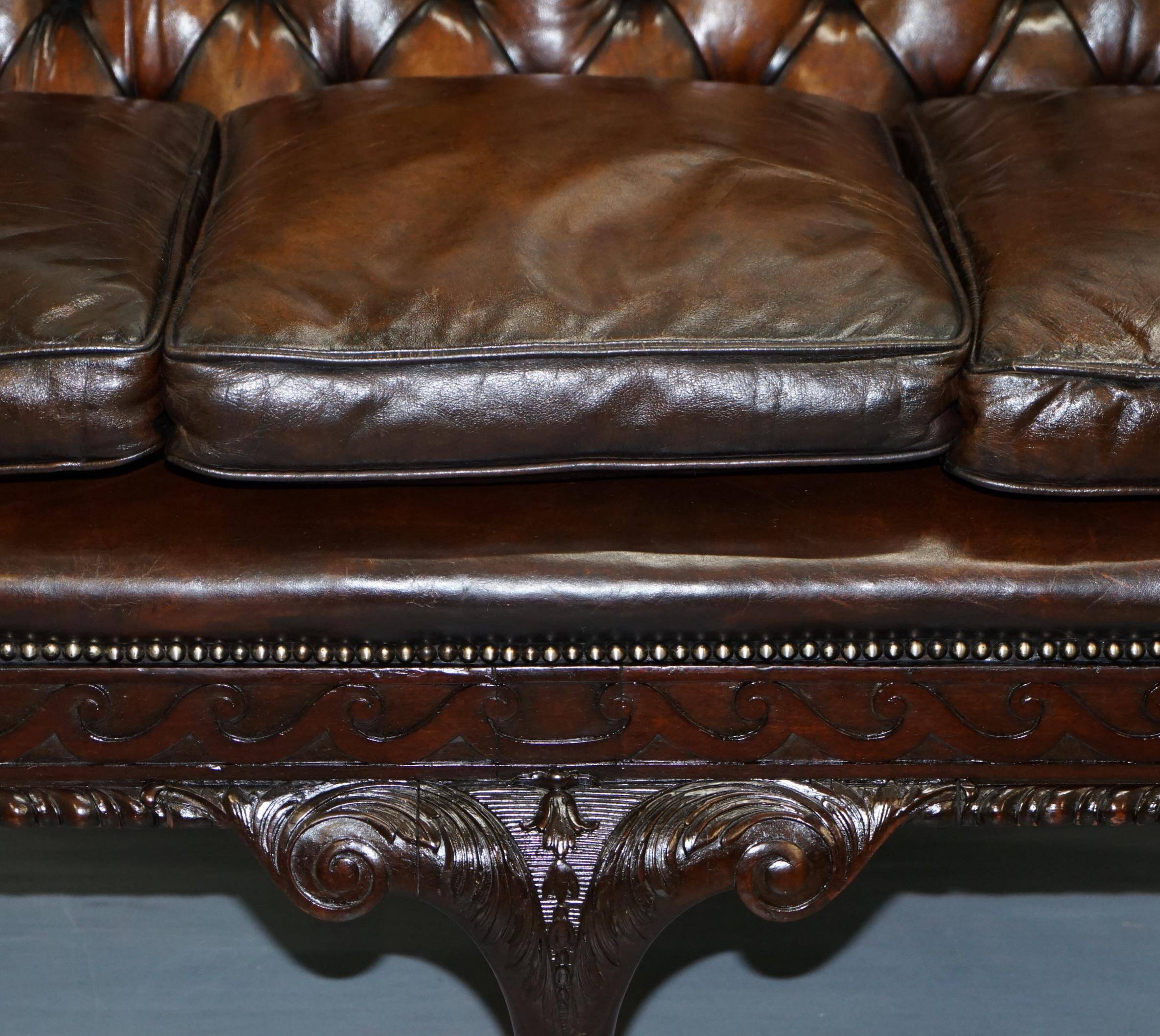 Chesterfield leather canapé in Georgian style with lion paw carved feet.