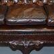 Chesterfield leather canapé in Georgian style with lion paw carved feet.