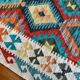 Oriental kilim rug afghan colored red and multicolored