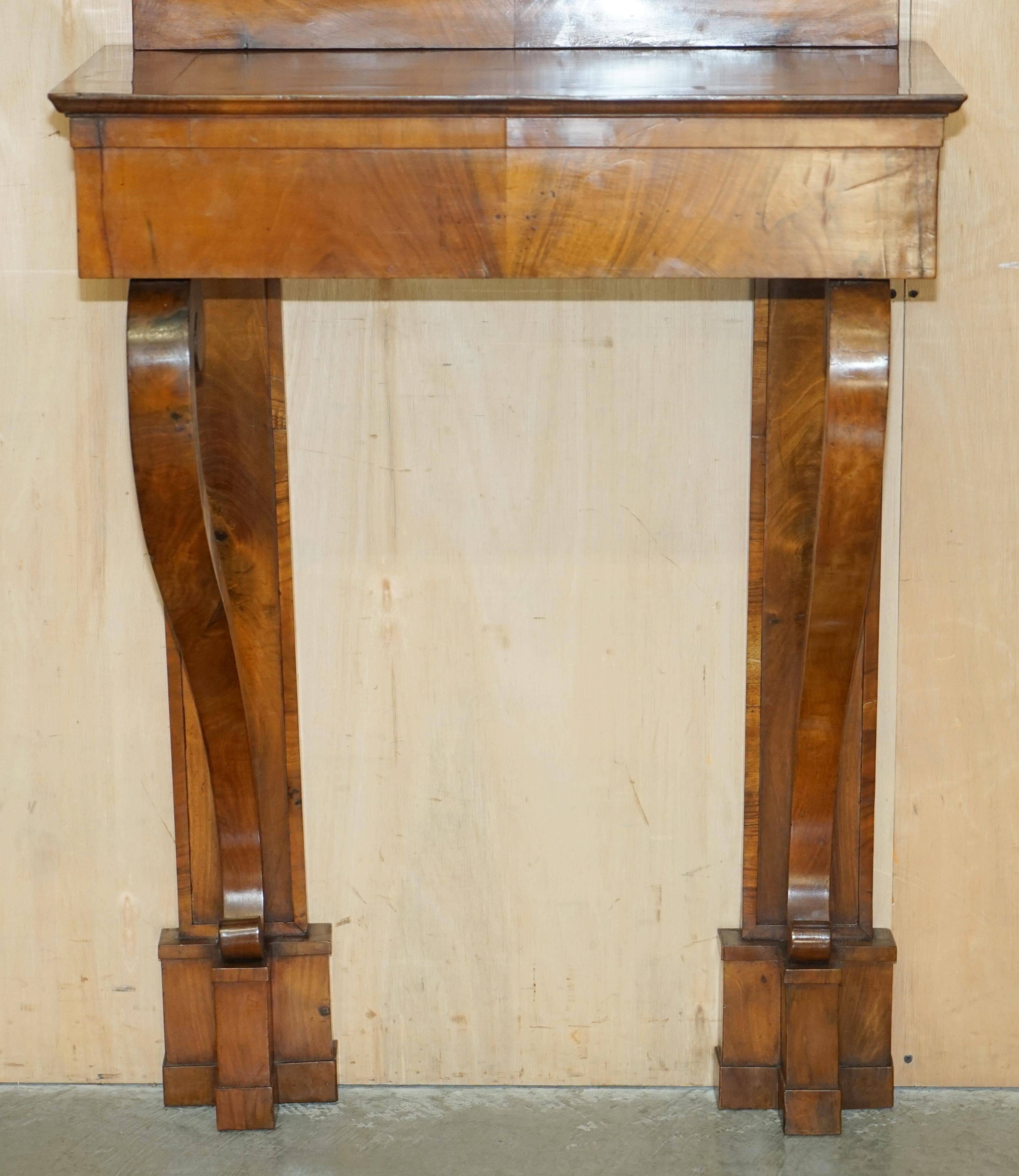 Pair of restored antique consoles from around 1815 in walnut, Regency style with mirror.