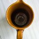 Vintage enameled ceramic watering can vase - retro mustard yellow pot.