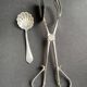Cake tongs and spoon to sprinkle silver metal