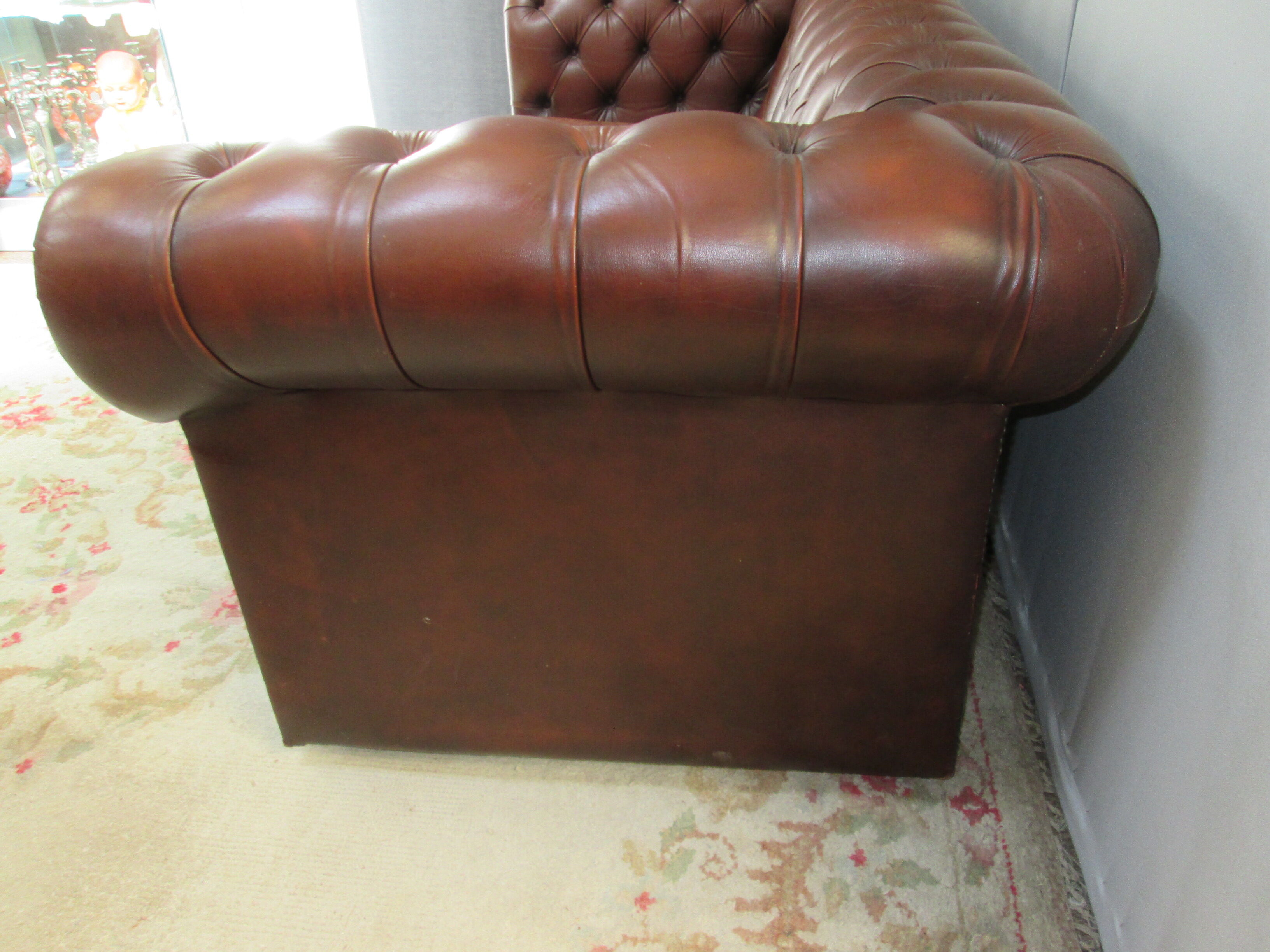 Brown leather chesterfield sofa