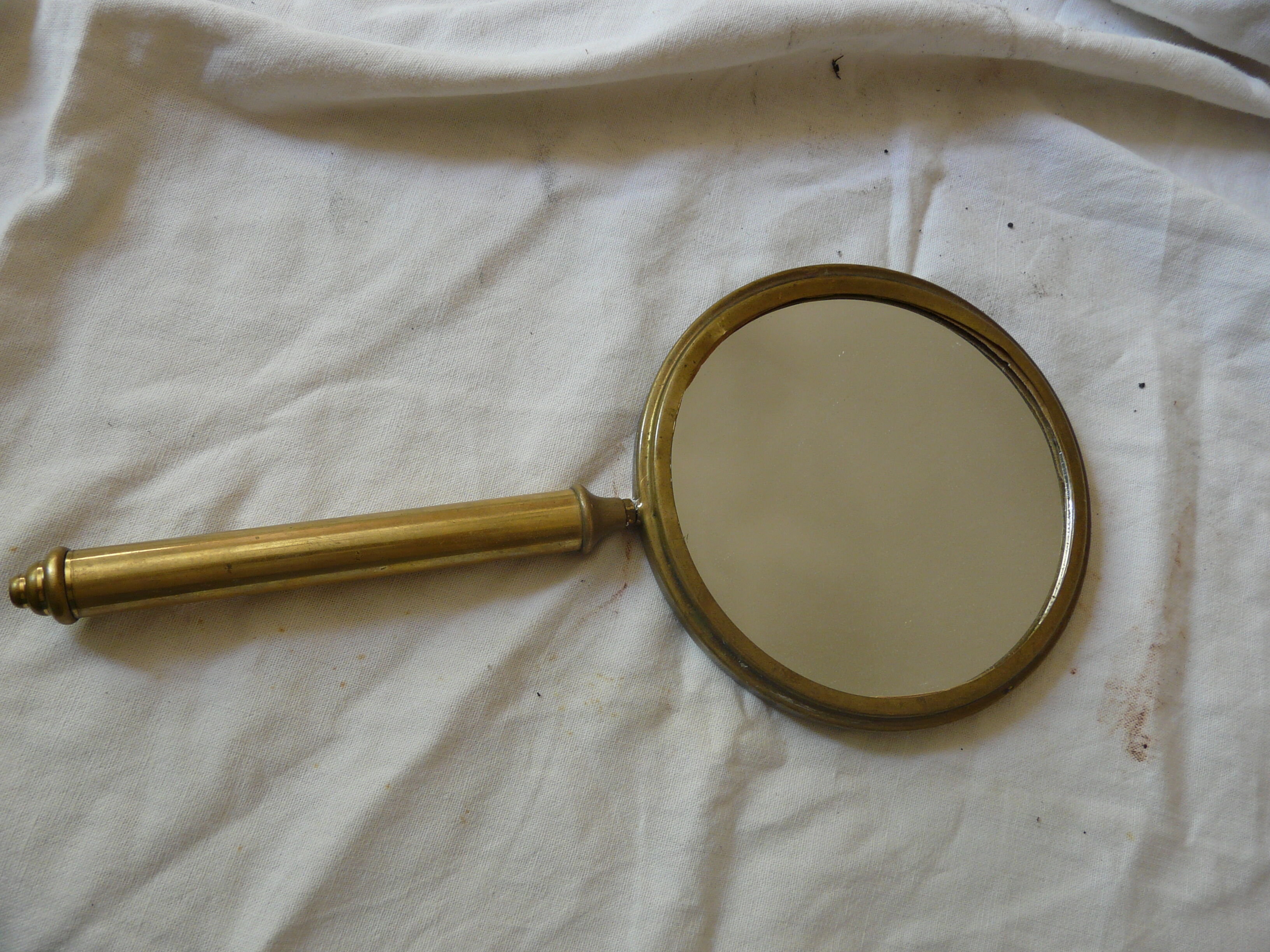 Art Deco era brass hand mirror