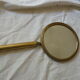 Art Deco era brass hand mirror
